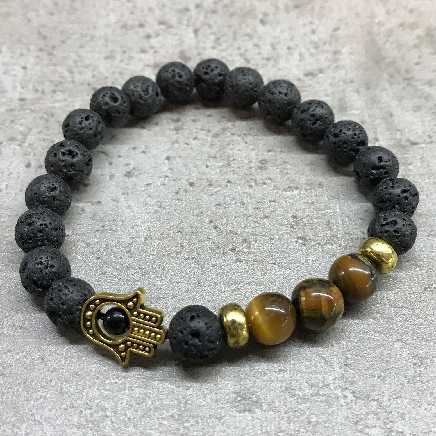 Pulsera de Lava y Ojo de Tigre - Mano de Fátima (Hamsa)